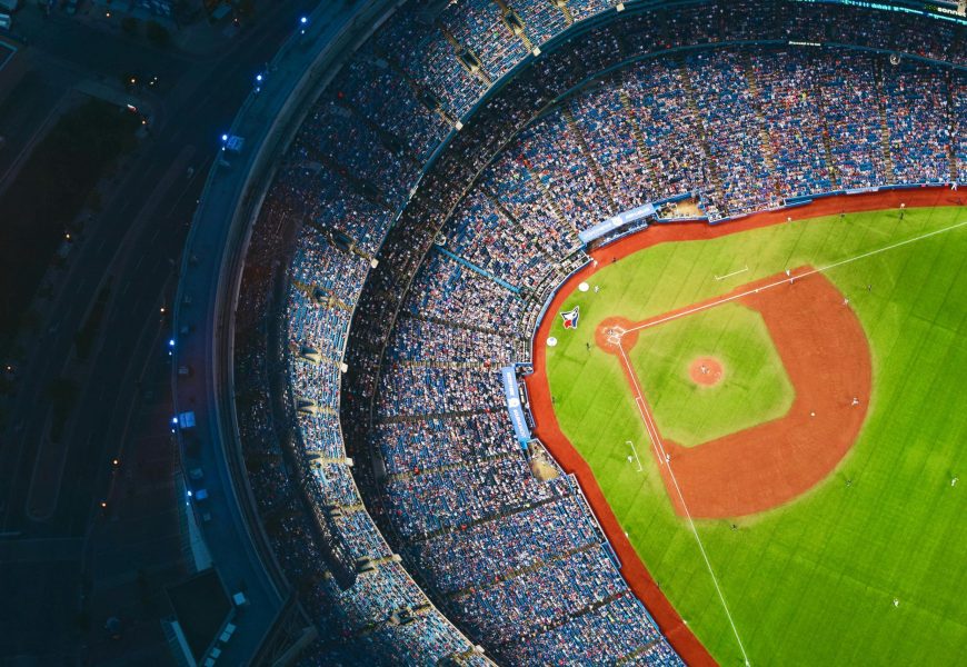 High-angle view of a crowded baseball stadium with green field in Toronto during a game.