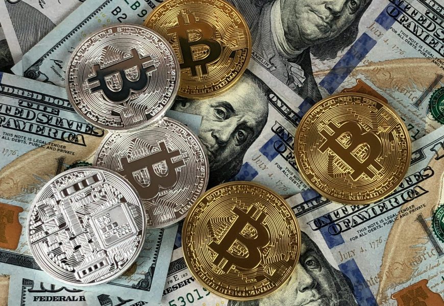 Close-up of bitcoins and US dollar bills symbolizing modern finance and cryptocurrency.